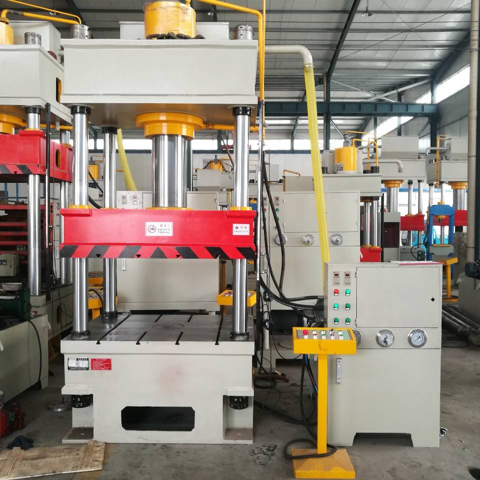 Four-column hydraulic press machine in a manufacturing facility